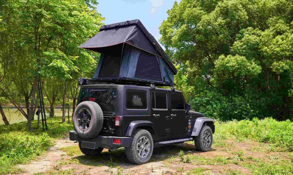 A picture of the hard shell roof tent in the forest